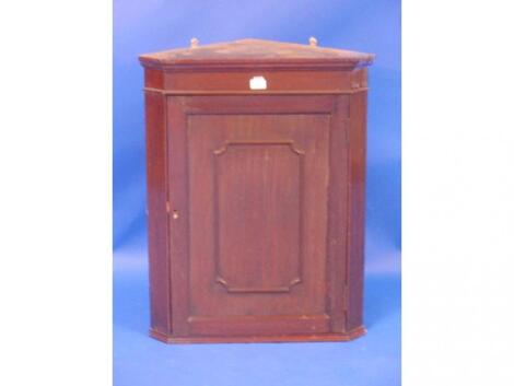 An Edwardian mahogany hanging corner cupboard