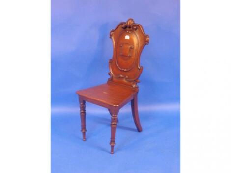 A Victorian oak hall chair