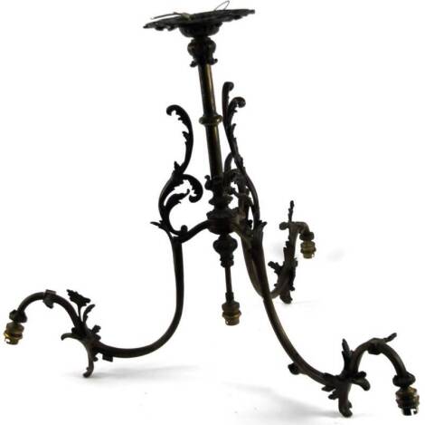 A 20thC metal framed table lamp, with three naturalistic S branches with applied leaves, on cylindrical stem and pierced flowerhead base, 62cm H.