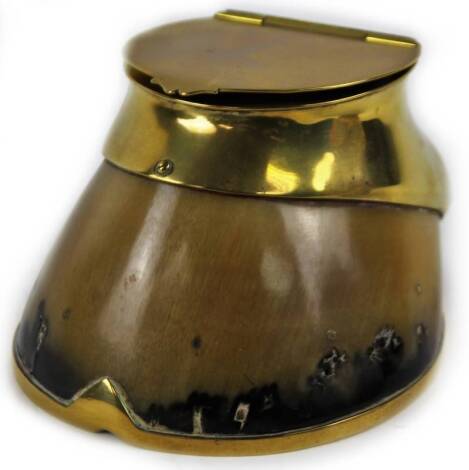 An early 20thC horse's hoof inkwell, with brass mounts, 11cm H.