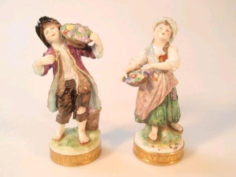 A pair of 20thC Sitzendorf porcelain figures of flower sellers