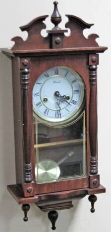 A 20thC Lincoln wall clock, 17cm Dia. Roman numeric dial, 8-day movement, in a one piece carved case, 69cm H.