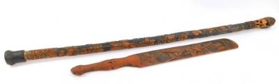 A Japanese Meiji period bamboo walking stick, the knop carved with mushrooms and leaves, above a shaft carved in bas relief with birds and chrysanthemums, 19.5cm L, together with a bamboo page turner, carved with Samurai Warriors, 51cm L. (2)