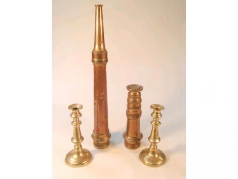 Two brass and copper fireman's hose nozzles