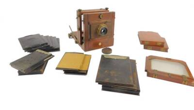 An E & T Underwood mahogany box plate camera, together with wooden and tin plates.