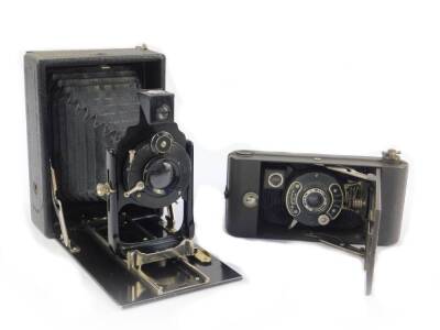 A Houghton Butcher Manufacturing Company Ensign Greyhound camera, with a synchro A shutter, cased and boxed, together with a further camera, maker unknown, with a Periskop Alpha lens. (2)