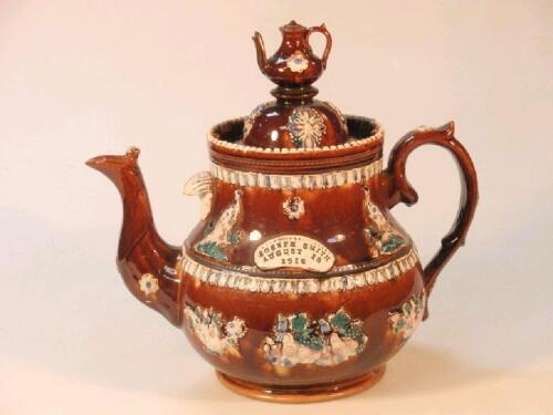 A Measham barge ware moulded teapot and cover