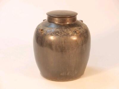 An oriental bronze ginger jar and cover