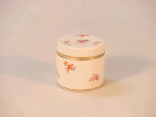 A Meissen porcelain rouge pot and cover