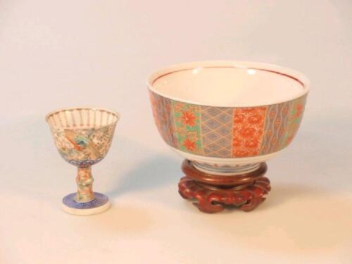 A Japanese bowl on hardwood pedestal and a stem cup