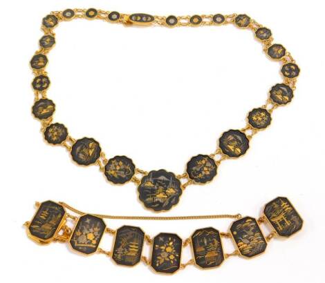 Two Japanese damascene jewellery items, comprising an etched design graduated necklace, with landscapes and building scenes, and a matching bracelet, gold plated. (2)