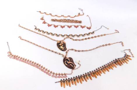Copper brass style stone set or enamel decorated necklaces, to include examples marked M O Matise, abstract pendants, etc. (1 bag)