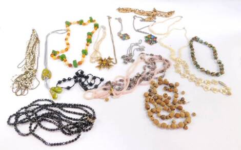 Costume jewellery necklaces, beaded examples to include wooden beads, imitation jet style necklace, elaborate paste stone set pendants, and various others. (1 bag)