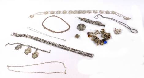 Modern costume jewellery, silver and white metal, including a silver plated floral belt buckle, a silver watch chain with three silver shield fobs, silver plated two row bracelet, a silver articulated necklace, a silver star marcasite necklace, silver cha