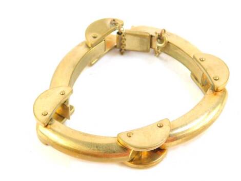 An articulated gold plated bracelet, of modern abstract design, with safety chain.