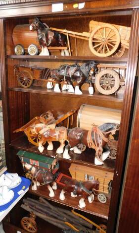 A collection of hand crafted gypsy wagons and carts, together with pottery figures of Shire horses. (qty)