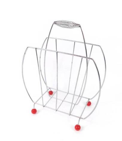 An atomic twin division magazine rack, raised on red ball feet, 45cm H, 35cm W.