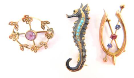 Three brooches, comprising a 9ct gold seahorse brooch, with blackened decoration and set with turquoise, 4cm H, a Victorian 9ct gold circular brooch, with central amethyst surrounded by flowers set with seed pearls, 2cm Dia, and a 9ct gold wishbone brooch