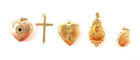 Various 9ct gold and other pendants, comprising a 9ct gold etched design heart locket, a 9ct gold heart locket with seed pearl decoration, lacking centre stone, (AF), a small 9ct gold oval engraved locket, a 9ct gold crucifix, engraved 1941, and a yellow 