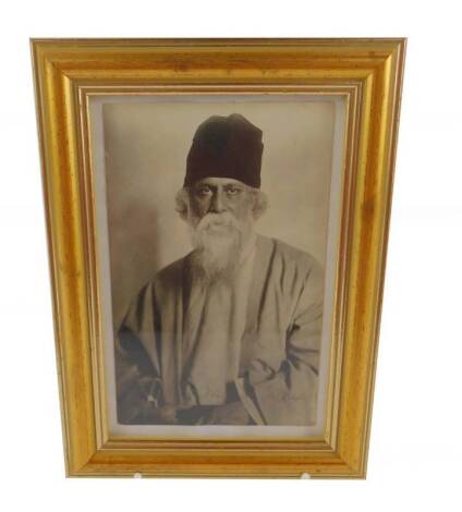 A signed photograph of the Indian poet Rabindranagh Teagore FRAS, 14cm x 9cm.