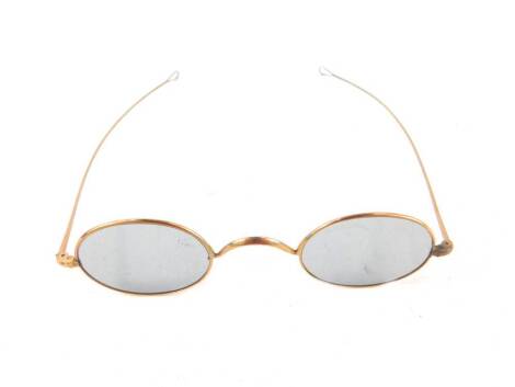 A pair of 9ct gold rimmed spectacles, cased.