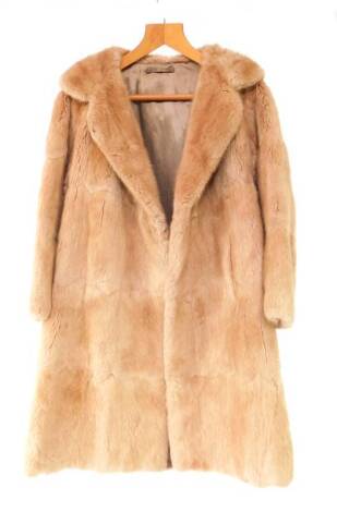 A full length fox fur coat, silk lined.