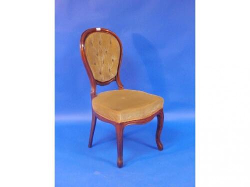 A set of five Victorian walnut dining chairs with oval cameo backs and cabriole forelegs