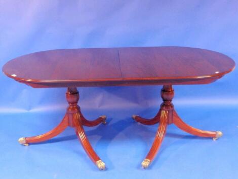 A good quality mahogany reproduction Regency extending dining table