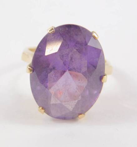 A 9ct gold and amethyst solitaire ring, claw set, the oval cut amethyst approx 10.5cts, size N, 6.9g.