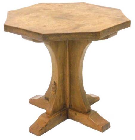 A Robert Thompson of Kilburn Mouseman oak coffee table, with an octagonal top, on concave support with 'X' shaped base, 47cm H, 50cm W.