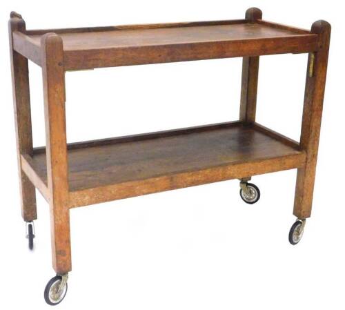 A Robert Thompson of Kilburn Mouseman oak two tier trolley, on square section supports, with castors, 87cm W.