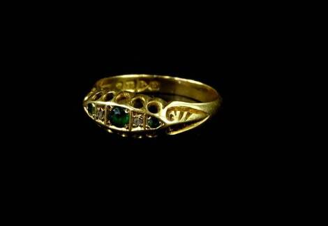 An 18ct gold emerald and diamond gypsy ring, with scroll design head, ring size N½, 2.5g all in.