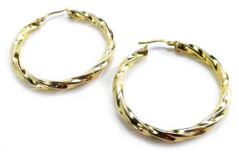 A pair of 9ct gold hoop earrings, each of twist design, 3.2g all in.