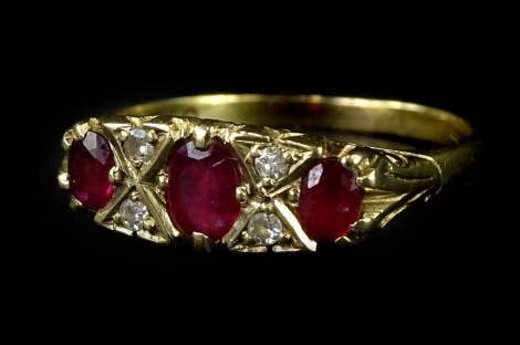 A 9ct gold dress ring, set with garnet and imitation diamonds, in gypsy style, with claw settings, and scroll design borders, ring size Q, 2.6g all in.