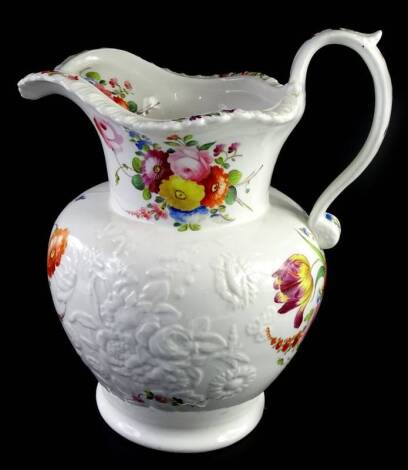 A mid 19thC Staffordshire porcelain jug, painted with flowers and with flowers moulded in relief, unmarked, 29cm H.