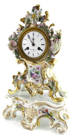 A 19thC French porcelain mantel clock, the case painted with flowers and with flower encrusted decoration, within rococo scroll gilt borders, on a similar base, the enamel dial signed Mare Paris, 34cm H.