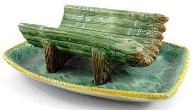 A Victorian Majolica asparagus stand, moulded with asparagus with pierced base on a rectangular dished base, 28cm W.