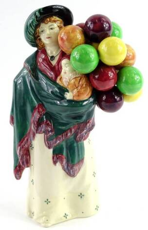 A Royal Doulton porcelain figure The Balloon Seller, HN583, 23cm H.