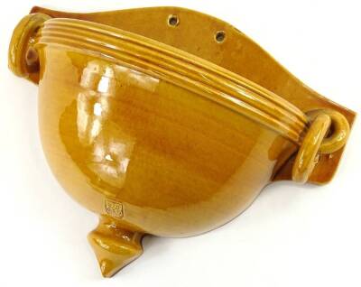 A Biot French art pottery wall vase, with two handles and deep yellow glaze, 32cm W.