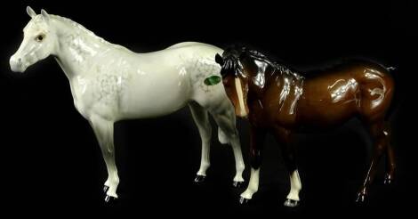 A Beswick grey horse, with original green label, 24cm W, and a brown horse. (2)