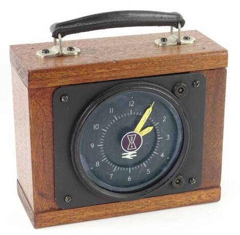 A British Rail locomotive clock, with blackened dial, stamped Deuta, possibly intercity, in later mahogany travelling case, 22cm W.