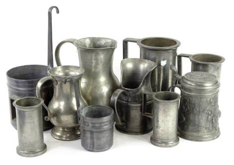 A collection of French pewter, to include two grain measures with loop handles, a plain cylindrical jug, makers stamp JG etc., and four French pewter measures, each of cylindrical form with angular handle, to include 1 litre, ½ litre and two double decili