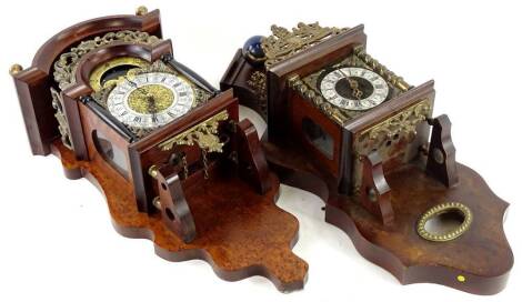 Two Continental walnut wall clocks, to include an example mounted with an Atlas figure, another similar. Provenance: This timepiece formed part of Luke Jerram's installation Harrison's Garden, at The Ropewalk Gallery, Barton Upon Humber 2019.