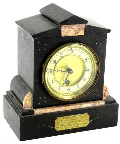 A French black slate and marble mantel clock, the enamel type dial with Arabic numerals, bearing brass plaque, engraved Presented to Miss Grainger etc., 1915, 25cm H. Provenance: This timepiece formed part of Luke Jerram's installation Harrison's Garden, 