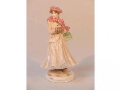 A Royal Worcester figure - Winter