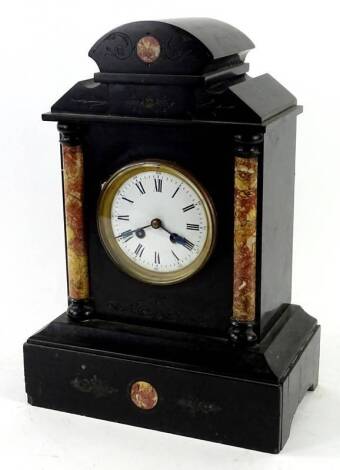 A French black slate and marble portico type mantel clock, the shaped top above two cylindrical pilasters, flanking a white enamel dial with Roman Numerals, 41cm H. Provenance: This timepiece formed part of Luke Jerram's installation Harrison's Garden, at