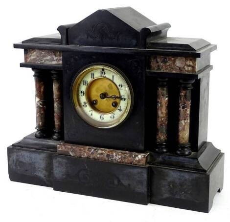 A portico type French black slate and marble mantel clock, the enamel type dial with Roman Numerals, 33cm H. Provenance: This timepiece formed part of Luke Jerram's installation Harrison's Garden, at The Ropewalk Gallery, Barton Upon Humber 2019.