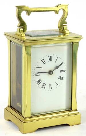 A French brass carriage timepiece, the white enamel dial with Roman Numerals, 15cm H. Provenance: This timepiece formed part of Luke Jerram's installation Harrison's Garden, at The Ropewalk Gallery, Barton Upon Humber 2019.