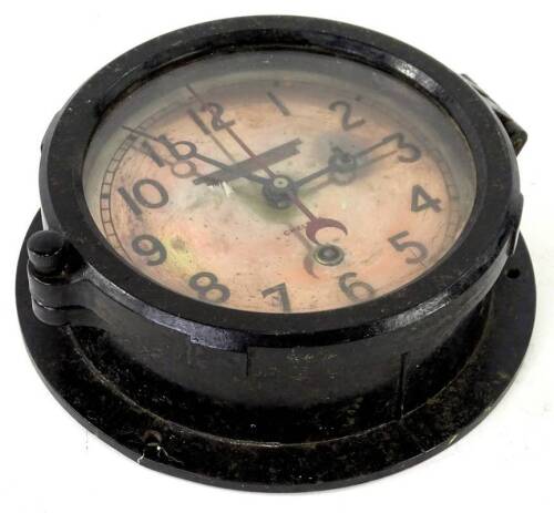 A cast iron ships bulk head timepiece, the silvered copper dial with printed inscription The Ontario Hughes Owens Company Limited, Ottawa Canada, engraved to the actual dial Chelsea, with sealable bezel, 19cm dia. Provenance: This timepiece formed part of