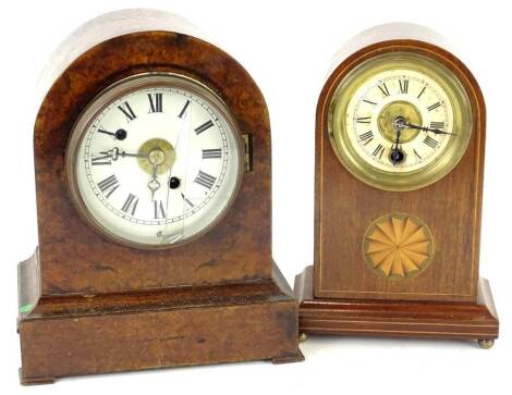 A mantel clock and a mantel timepiece, one in arched walnut case, the other mahogany with marquetry oval, 24cm and 23cm H respectively.(AF) Provenance: This timepiece formed part of Luke Jerram's installation Harrison's Garden, at The Ropewalk Gallery, Ba